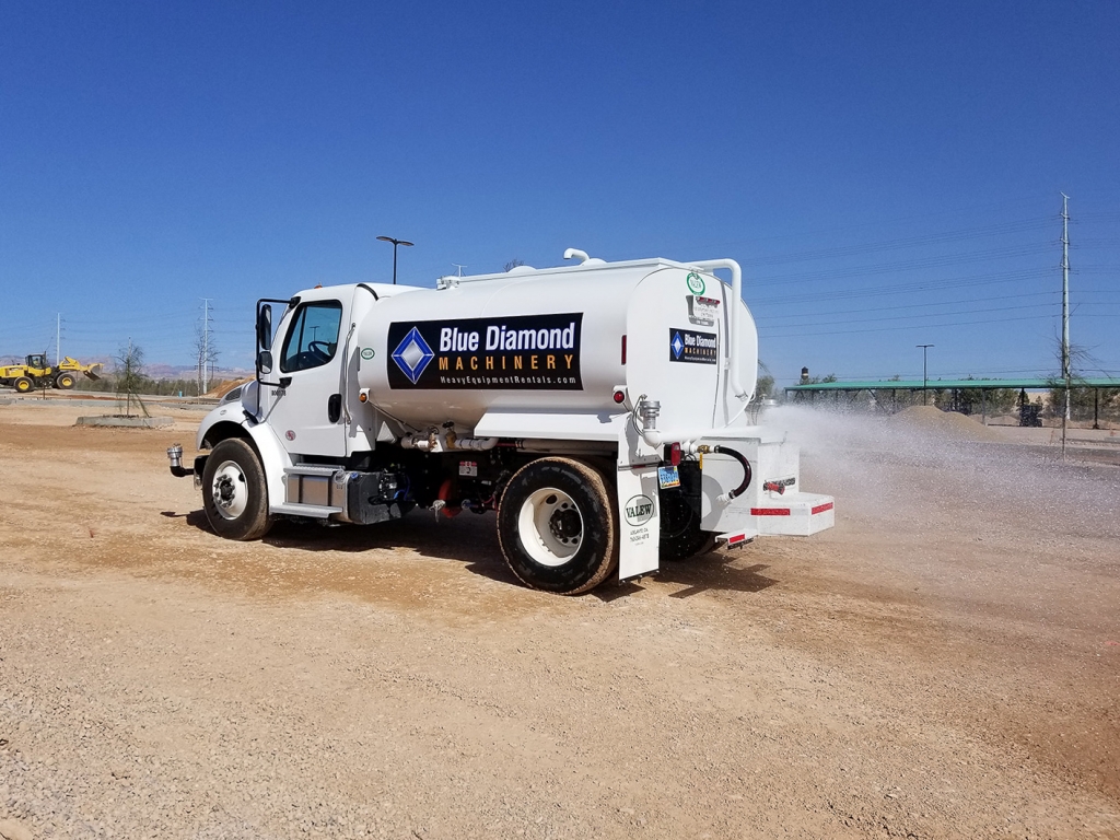 One of our 2000 gallon Water Trucks controlling the dust at a job site.